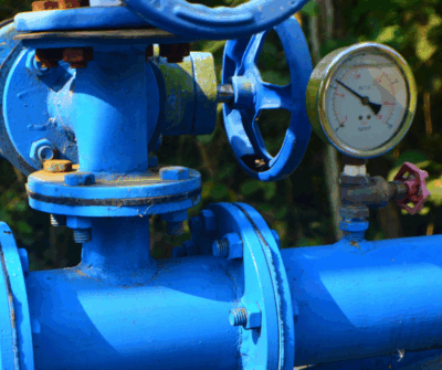 Construction of water main valves and hydrants in an urban setting.